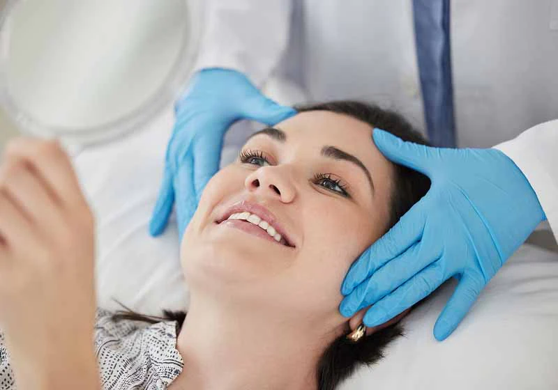 woman smiling at her appointment at Maple Ridge Smiles Dental