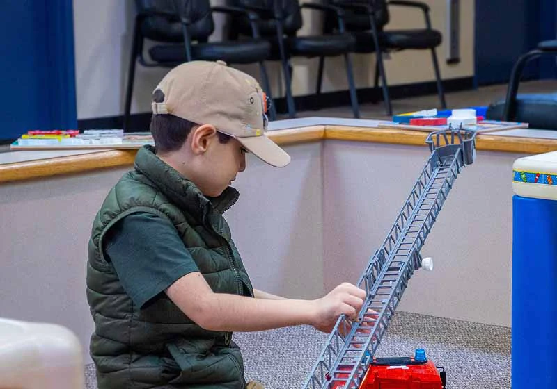 young child in the waiting room of Maple Ridge Smiles Dental